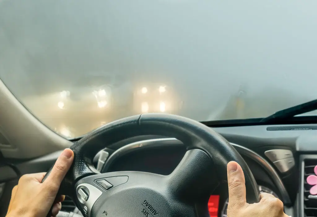 Car with Foggy Windshield and other cars in the Background