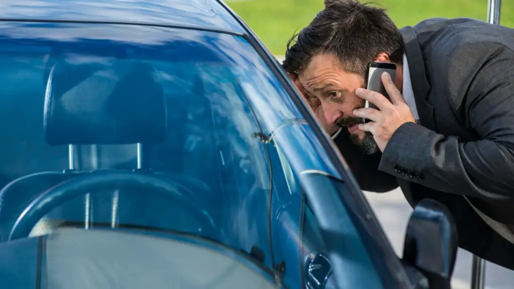 Scared man calls road assistance because his car keys are locked inside the vehicle